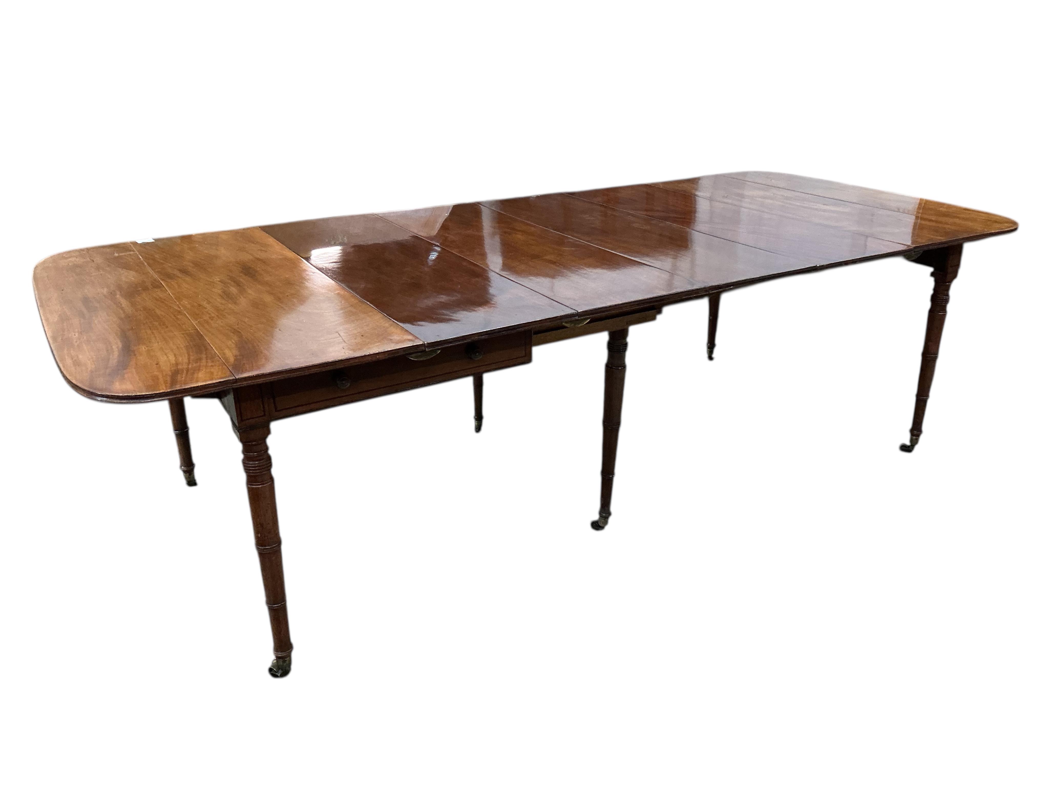 A Regency mahogany Pembroke extending dining table, width 258cm extended, depth 114cm, height 73cm